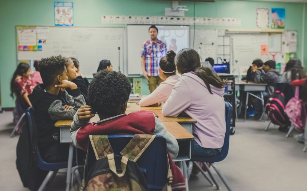 Teacher in a middle school classroom.
